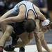 Skyline Chad Logen and Pioneer Keegan Pape wrestle in the 125-pound weight class on Wednesday, Feb. 6. Daniel Brenner I AnnArbor.com